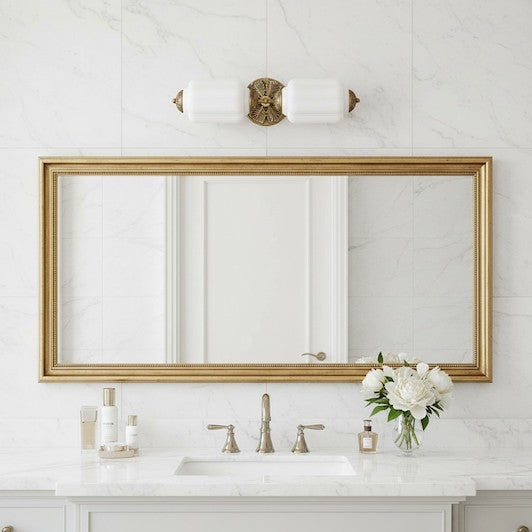 A luxury bathroom vanity featuring a vintage Art Deco milk glass light fixture.