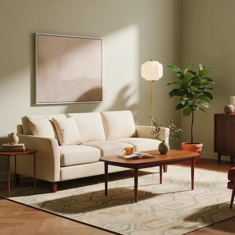 Modern textured glass floor lamp illuminating a cozy reading corner with a beige armchair.