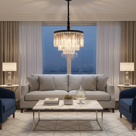A luxury living room featuring a vintage metal and crystal drum chandelier as the central masterpiece.