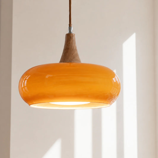 Orange Marie dome glass pendant in a bright sunlit interior