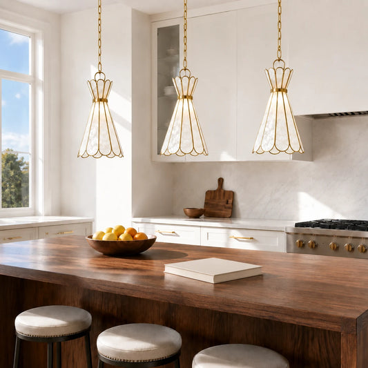 Three Mira Capiz shell pendant lights above a bright walnut kitchen island