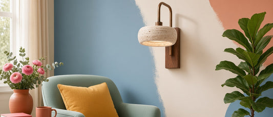 Completed American entry wall with a stone-and-wood sconce, artwork, console, and enough clearance for everyday movement.