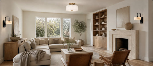 Living room combining stone, wood, linen, glass, and metal with coordinated ceiling and wall lighting and one clear dominant material.