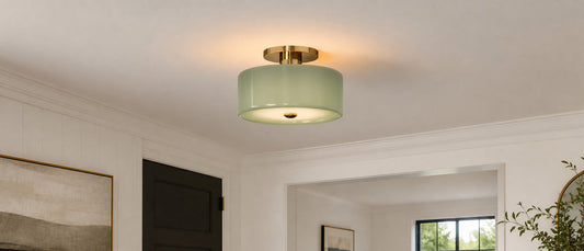 Modern glass drum semi flush mount ceiling light bouncing ambient illumination upward.