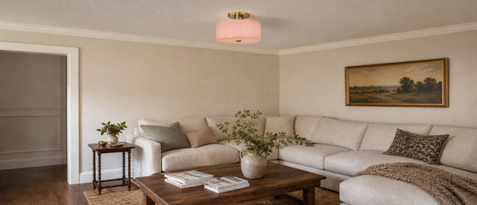Evron modern drum glass semi flush mount ceiling light installed in a residential living room.