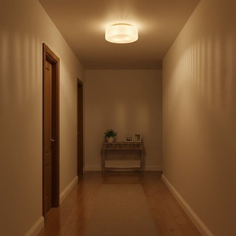 The Elowen Modern Opaline Ribbed Glass Ceiling Lamp mounted flush to a bedroom ceiling, showing its elegant and stable design.