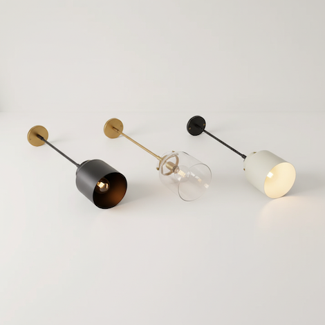 Artistic display of lighting materials: glass, matte metal, and marble.