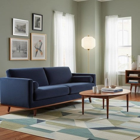 A balanced living room layout featuring a textured glass floor lamp as a visual focal point.