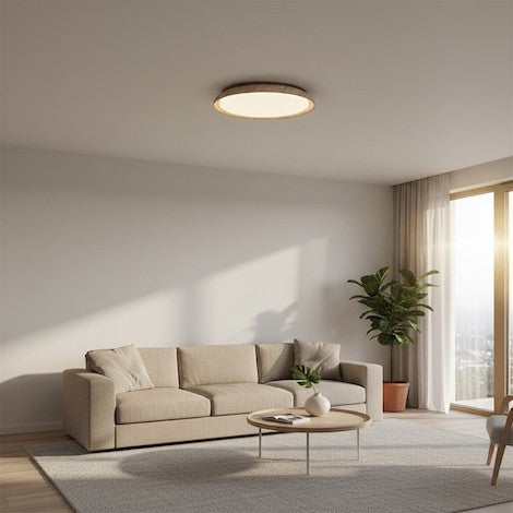 Modern apartment living room with a travertine round ceiling light.