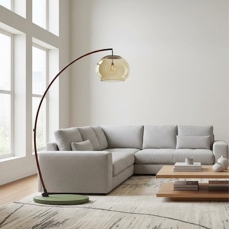 A tall arched floor lamp perfectly scaled to a living room with high ceilings.