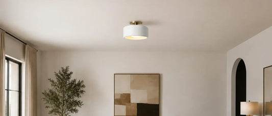 Low-profile white porcelain ceiling light in a bright room with an eight-foot ceiling