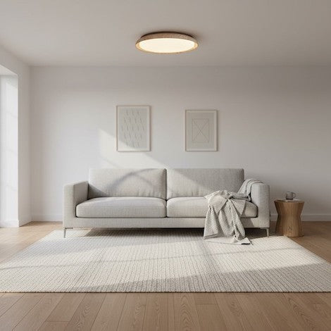 Scandinavian living room design featuring mixed textures and a travertine ceiling light.