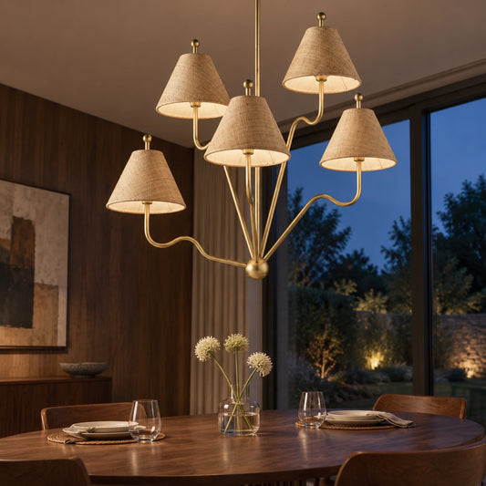 Isolde brass and raffia chandelier in a twilight dining room