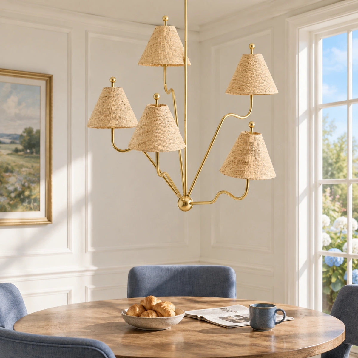 Isolde brass chandelier above a bright breakfast table