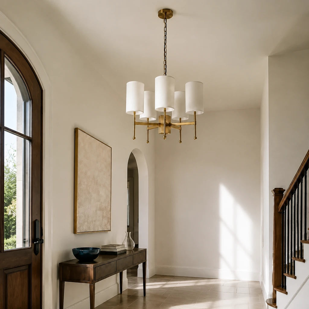 5-light Aster brass fabric shade chandelier in a bright American entryway with coherent side daylight
