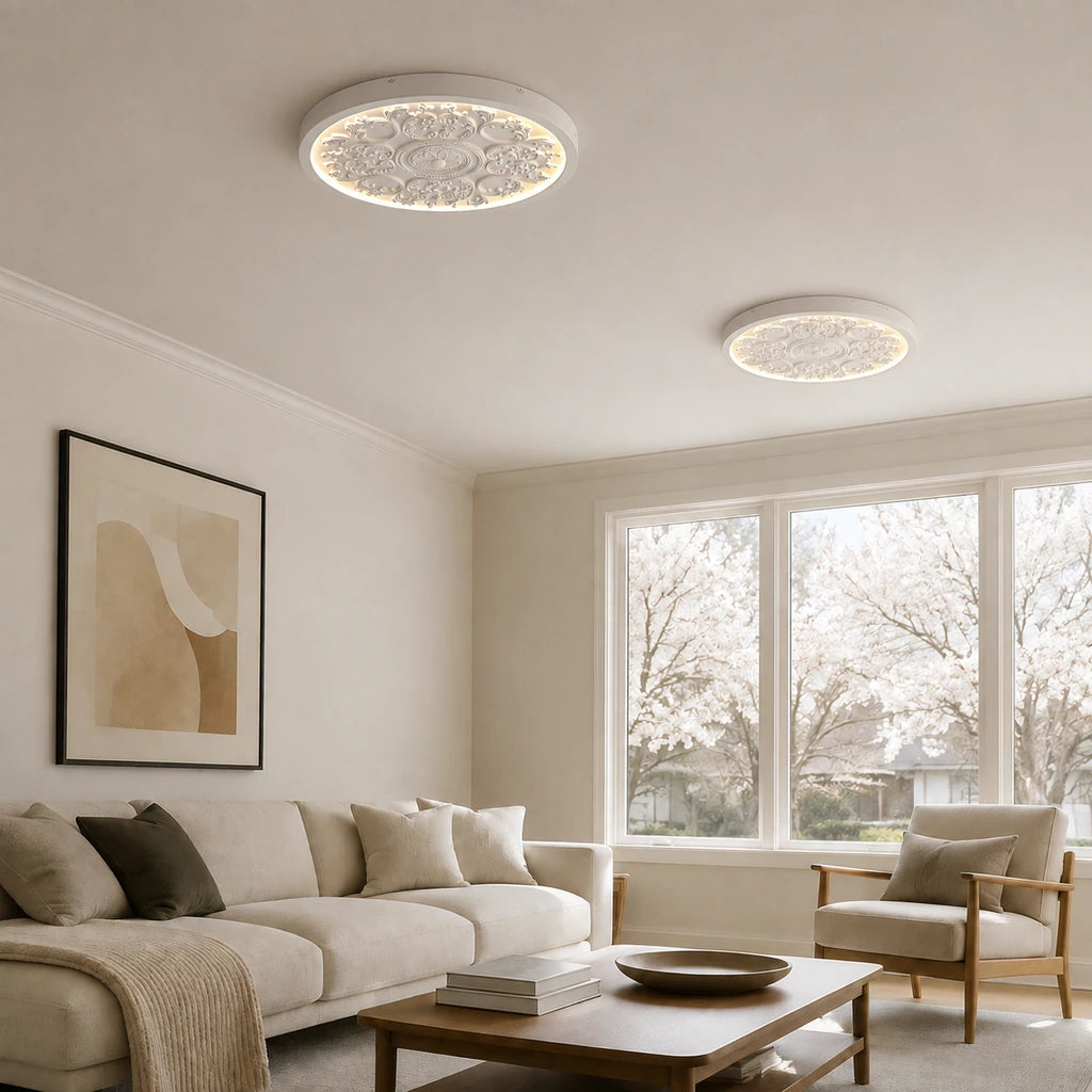 Two white medallion ceiling lights across a sunlit living room