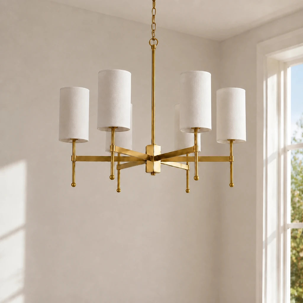 Close installed view of the 6-light Aster brass fabric shade chandelier with natural window light