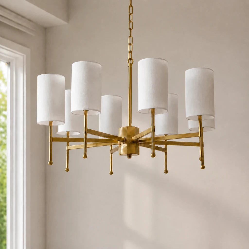 Close installed view of the 8-light Aster brass fabric shade chandelier with natural window light