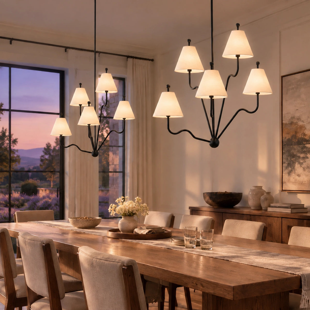 Two Isolde black chandeliers in an evening dining room