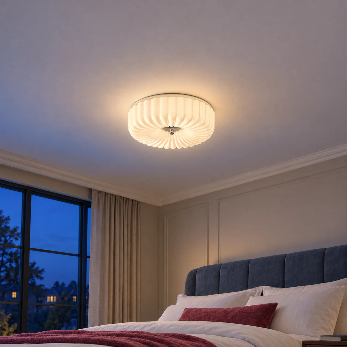 Maelis white flush mount in a lived-in blue-hour bedroom