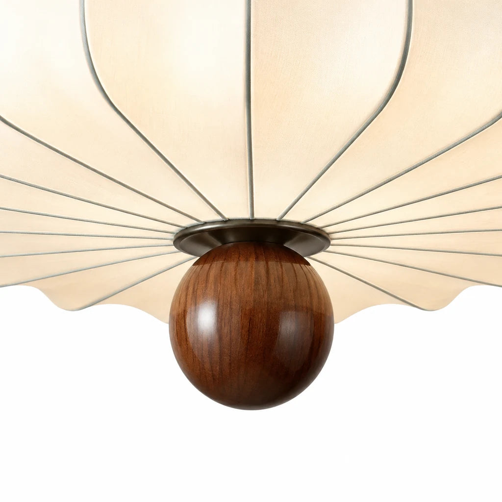 Close view of Alina spherical walnut finial and radial petal structure