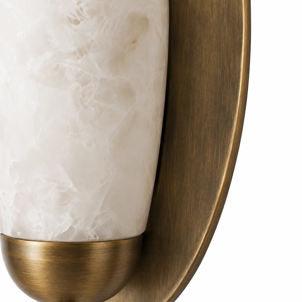 Macro of veined alabaster edge and antique brass frame