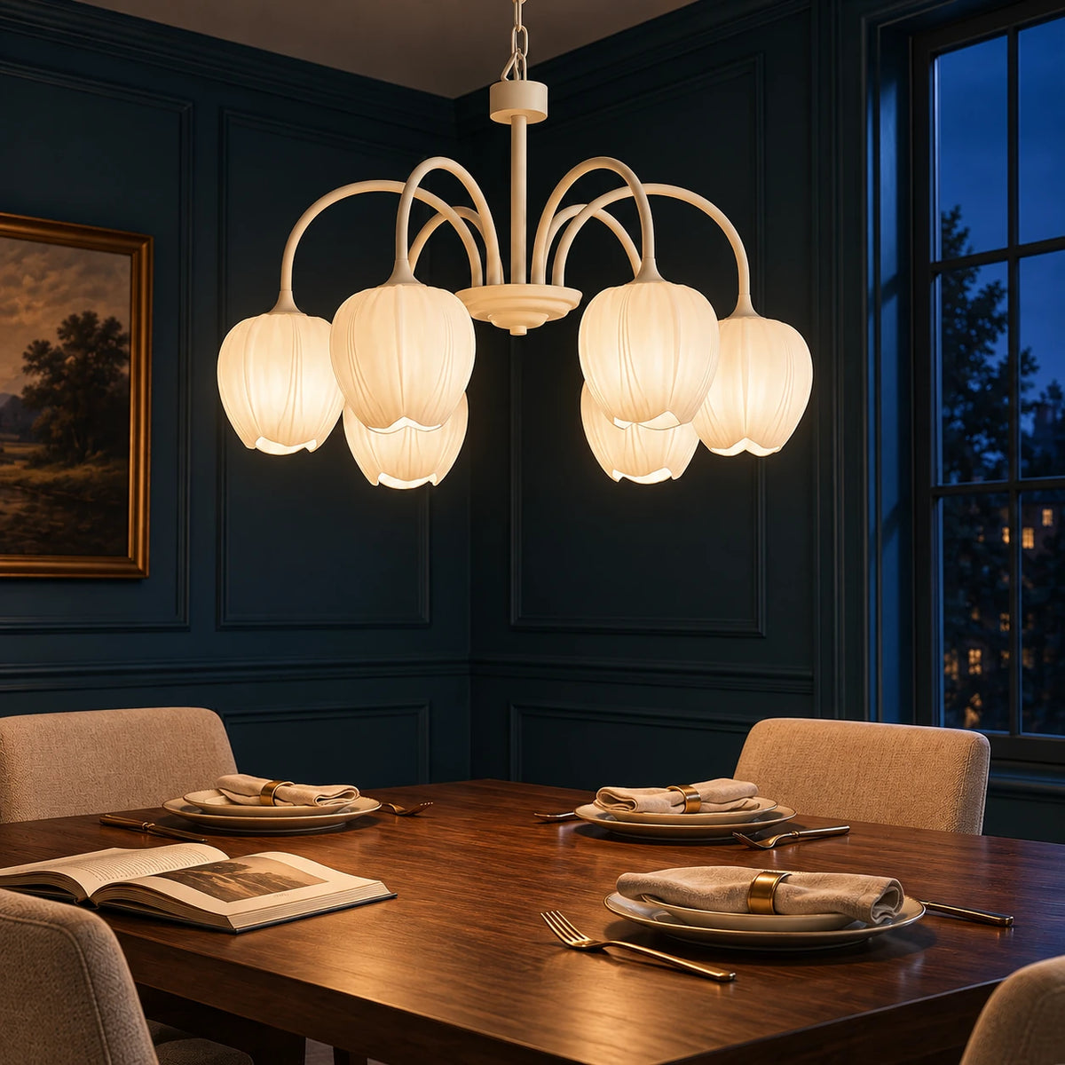 Six-light creamy white tulip chandelier fully shown in a dark blue dining room at night