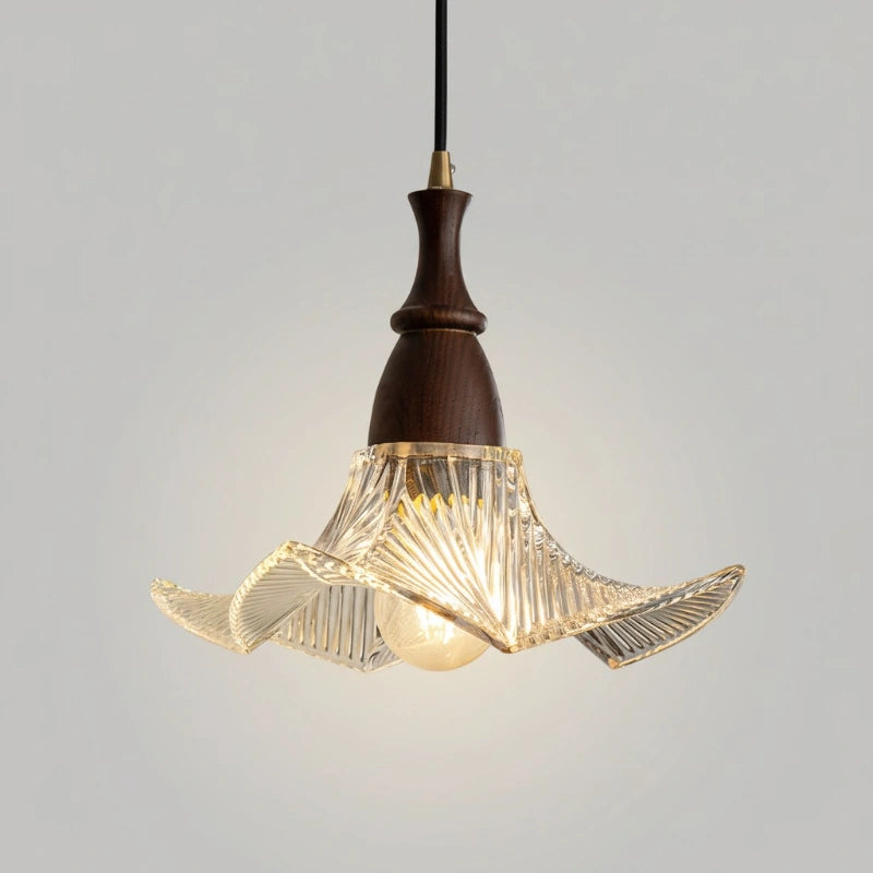 Pendant light with wooden fixture and glass shade on a gray background