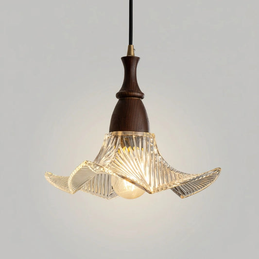 Pendant light with wooden fixture and glass shade on a gray background