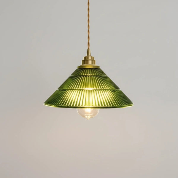 Green pendant lamp with brass fixture on a gray background