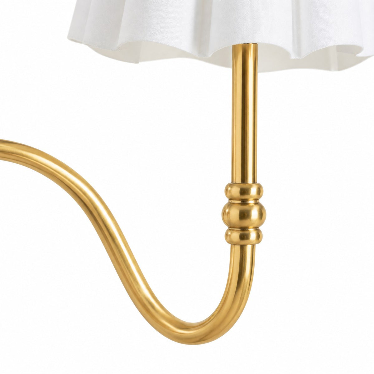 Close view of a serpentine antique brass arm and bead ring