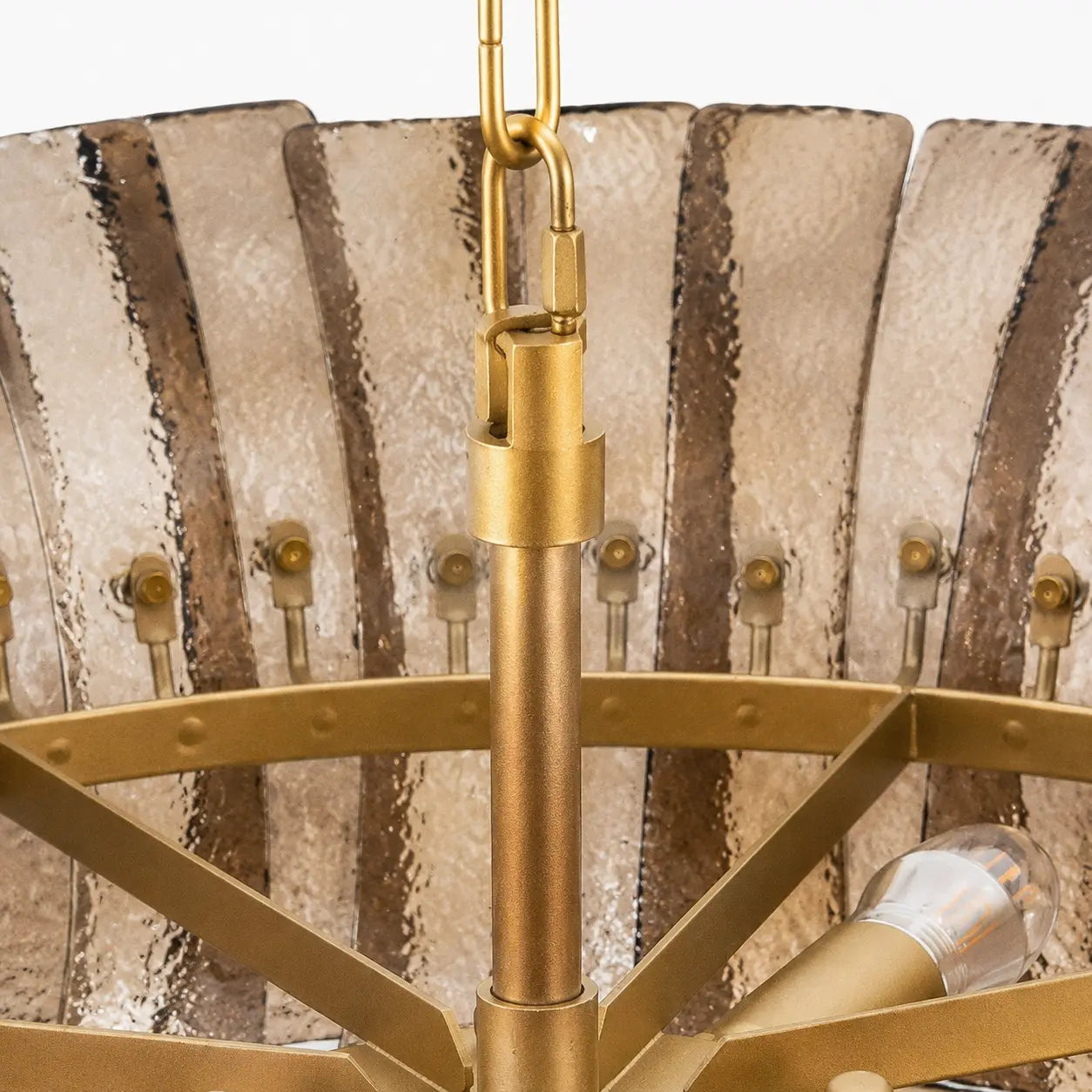 Close detail of the brass-tone frame and glass fasteners