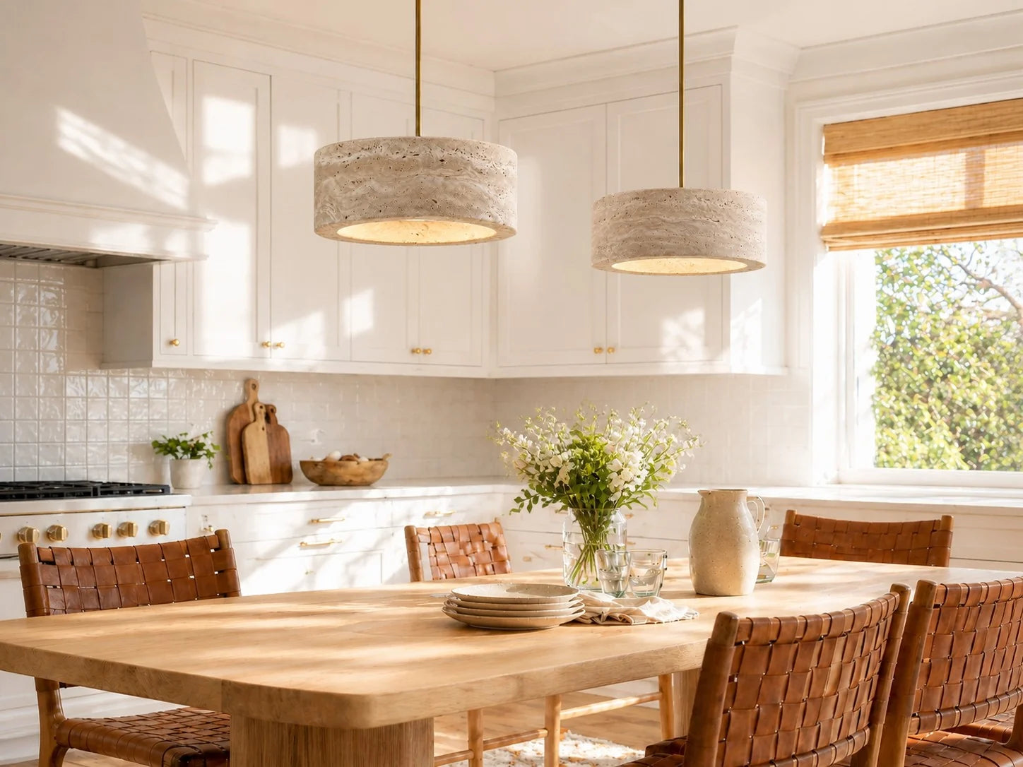 Travertine pendant lights over a dining table